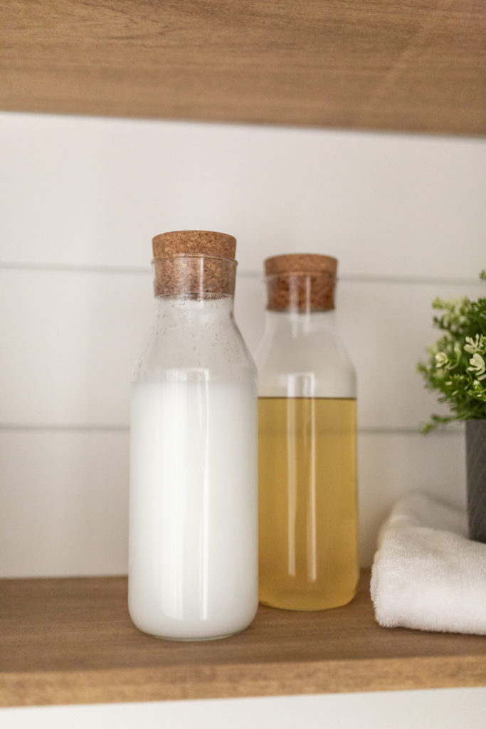 Laundry room makeover - I used Carafe bottles with cork lid from Ikea for my softener and washing detergent liquid.