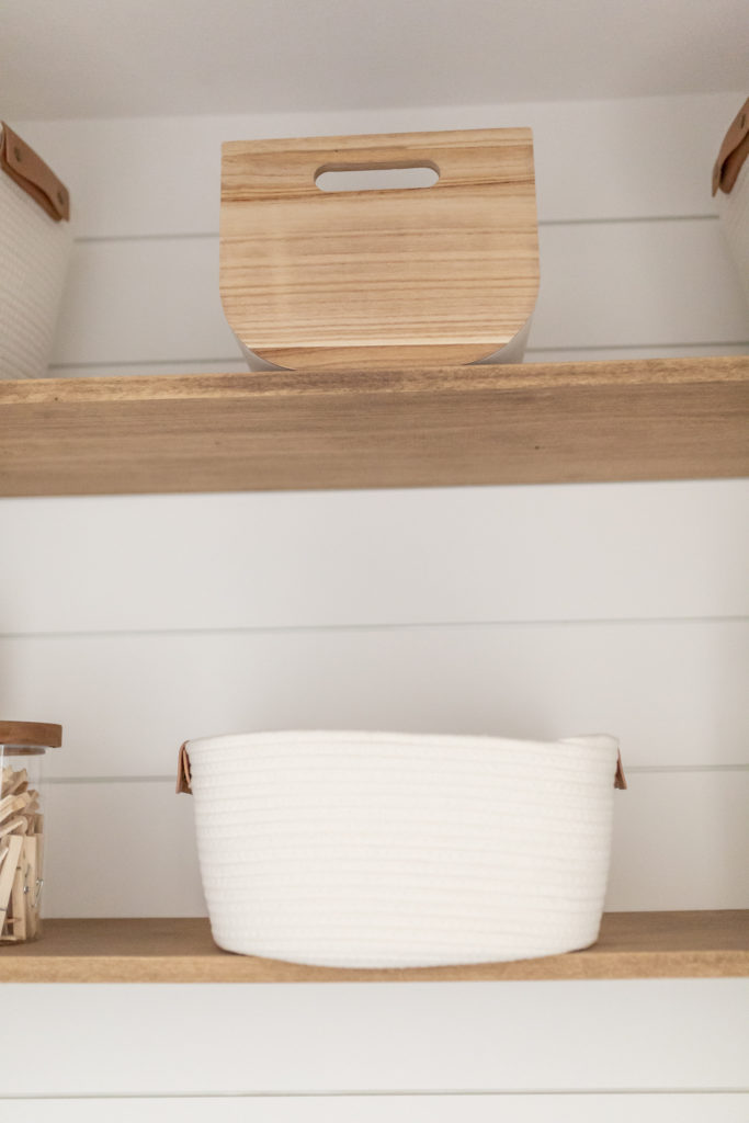 Laundry room makeover - A close up of the Paulownia Wood Bin and the small Coiled Rope basket from Target. 